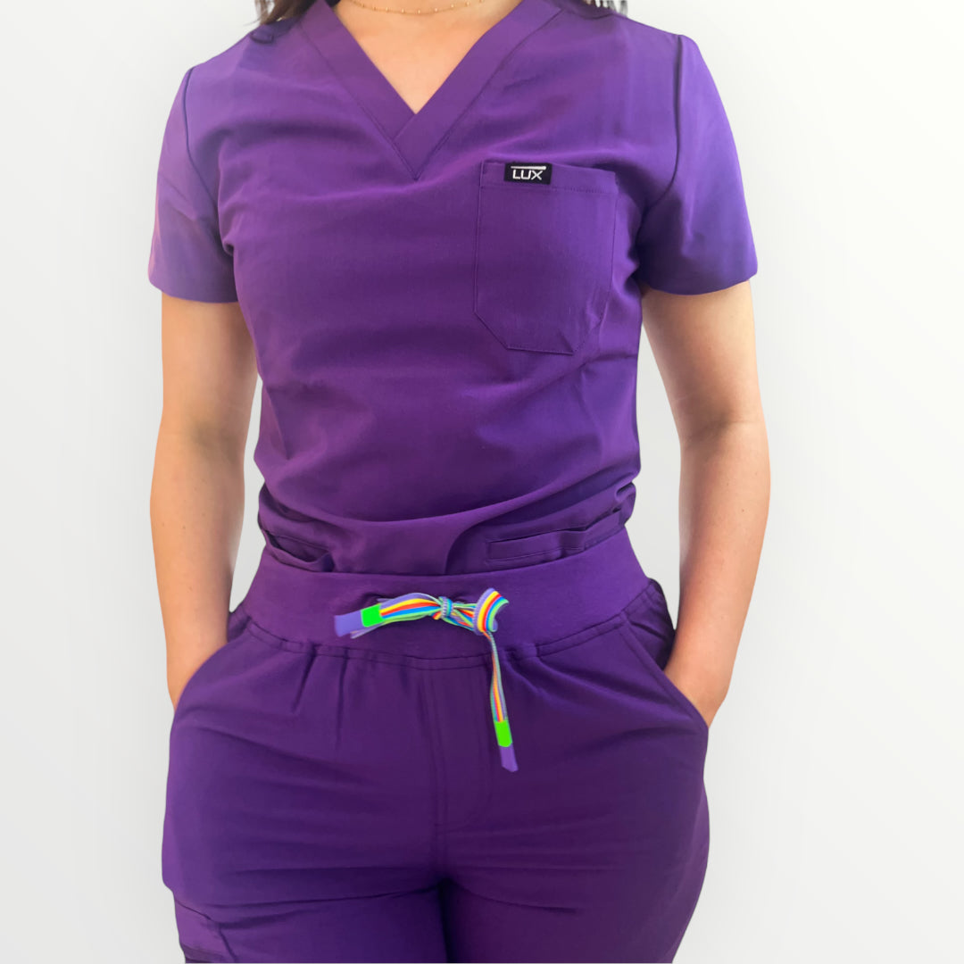 Lux Scrubs Deep purple Scrub Top. One chest pocket top, 2 lower front pockets