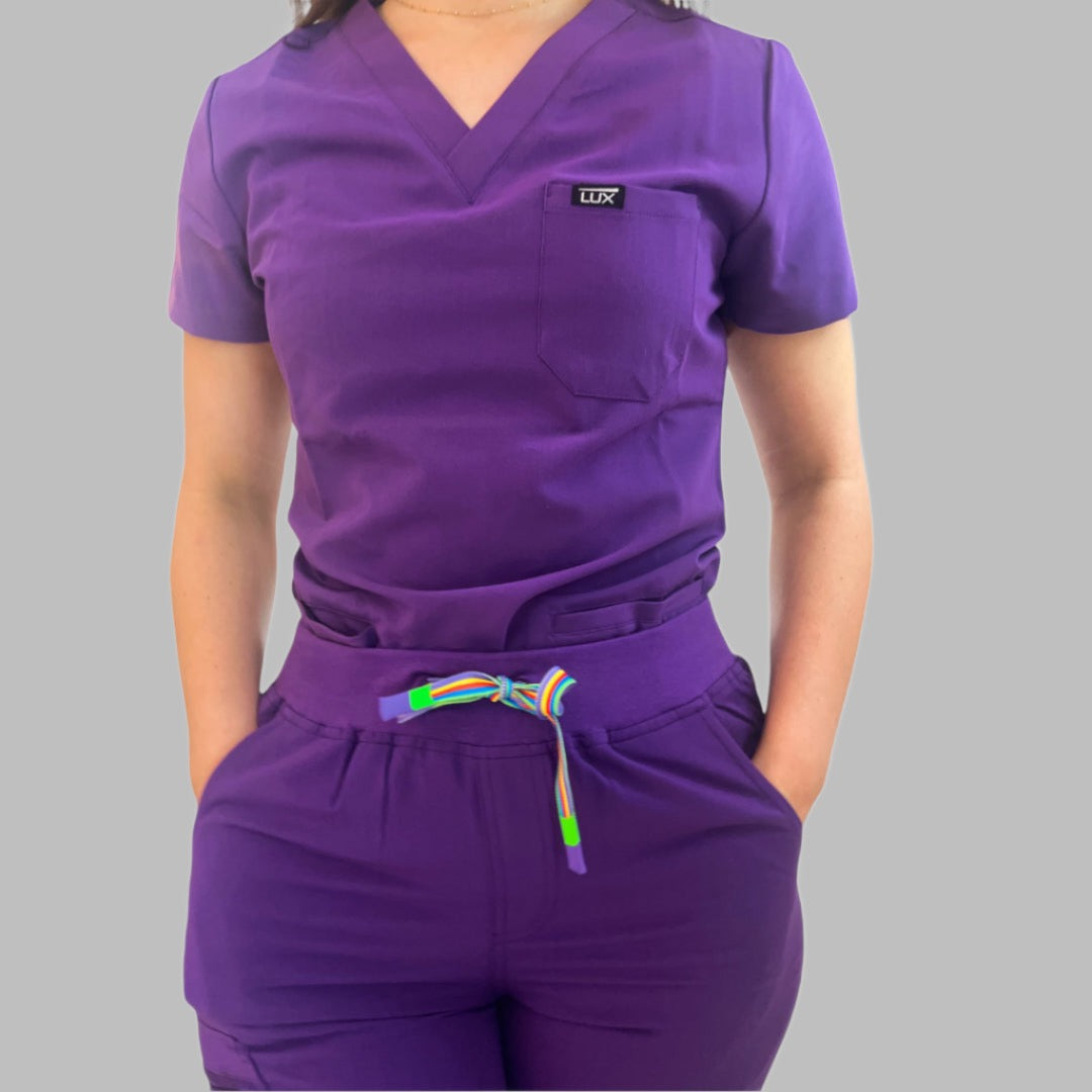 Lux Scrubs Deep purple Scrub Top. One chest pocket top, 2 lower front pockets